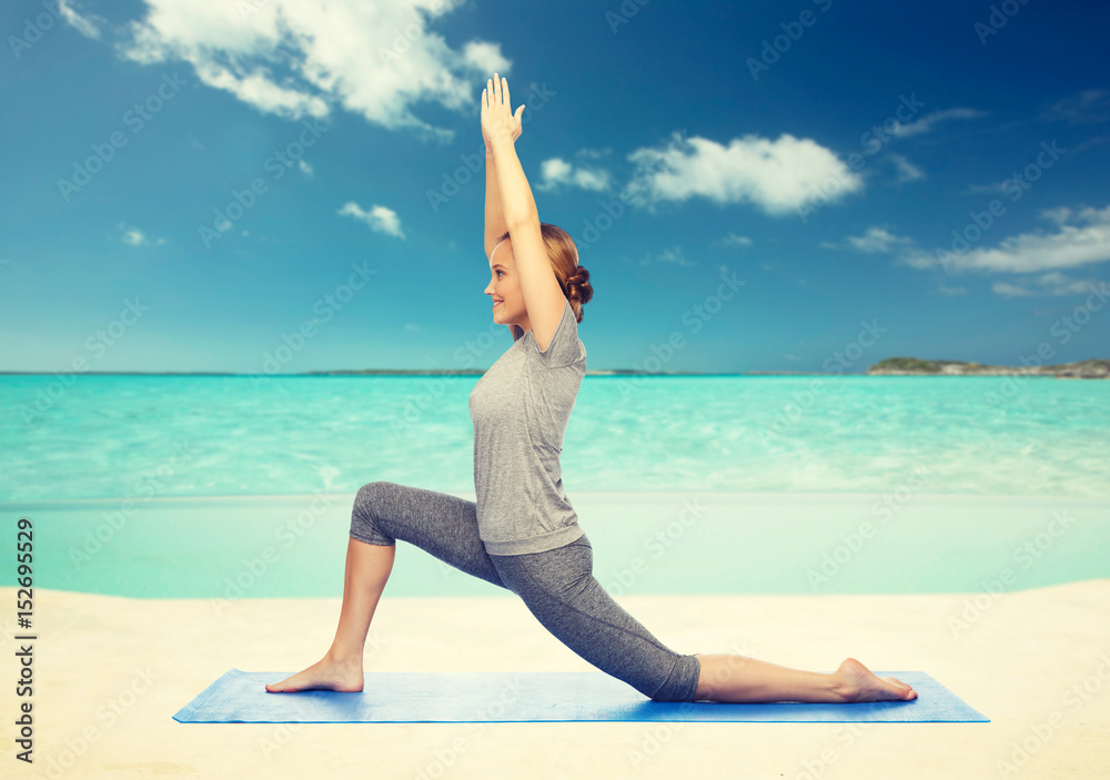 happy woman making yoga in low lunge on mat