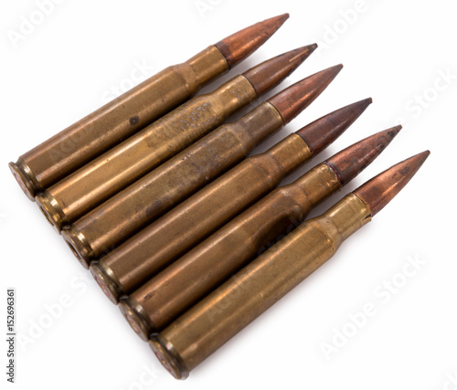 six military cartridges isolated on white background