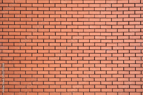 Modern new large red brick wall background © Tony Baggett
