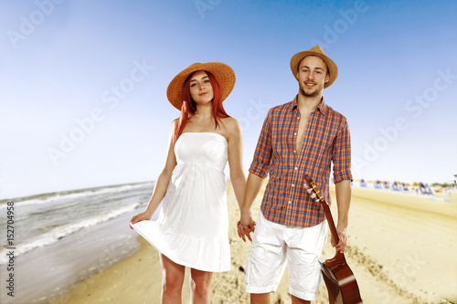 summer day on beach and two lovers 