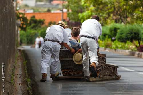 Toboggan riders on sledge in Monte - Funchal Madeira Portugal photo