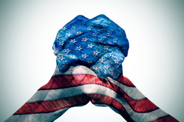 hands patterned with the US flag