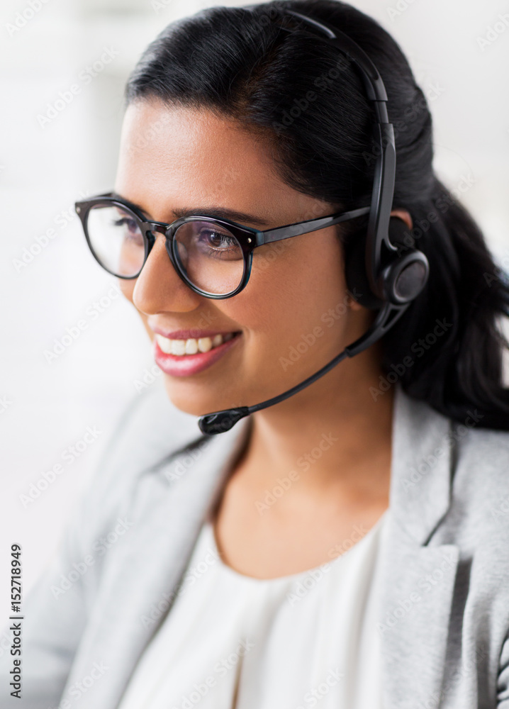 businesswoman with headset talking at office