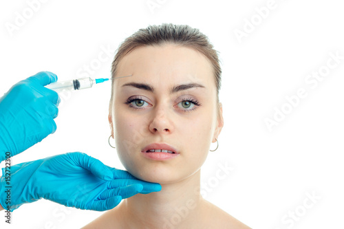 girl without makeup which doctor does prick at face close-up isolated on white background
