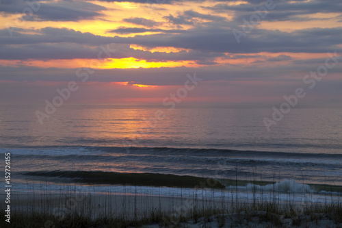 Dawn Wakes Over a Quiet Sea