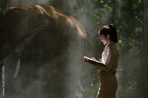 Beautiful woman and elephant with Thai teacher ,vintage style