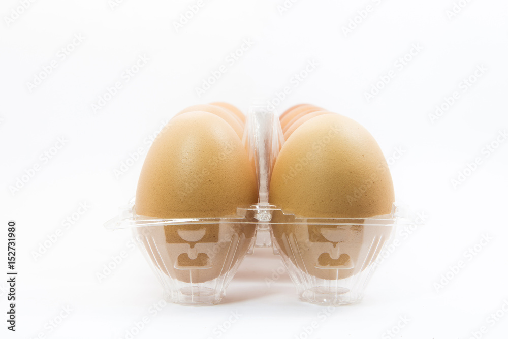 eggs in a plastic carton isolated on a white background eggs in a plastic carton isolated on a white background