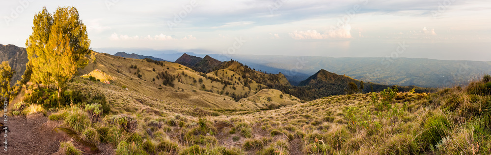 Panoramic view of the hills and coastline from the top of caldera Rinjani
