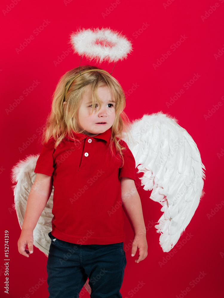 little angel boy crying with white feather wings and halo little angel boy crying with white feather wings and halo