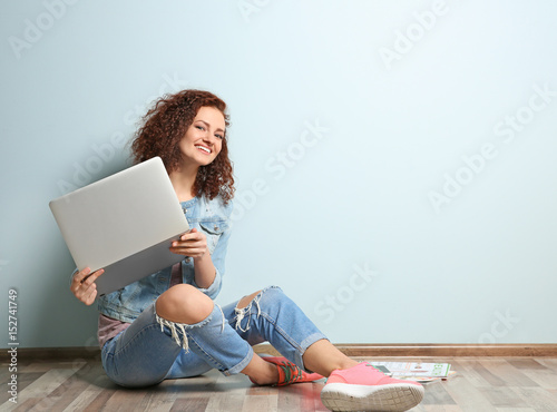 Beautiful young woman using...