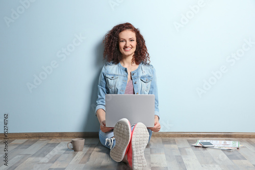 Beautiful young woman using...