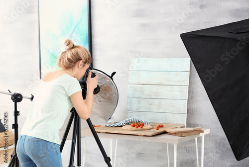 Young woman photographing f...