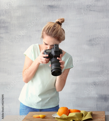 Young woman photographing f...