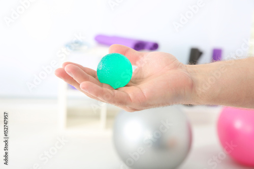 Male hand with stress ball ...