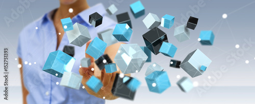 Businesswoman touching floating blue shiny cube network 3D rendering