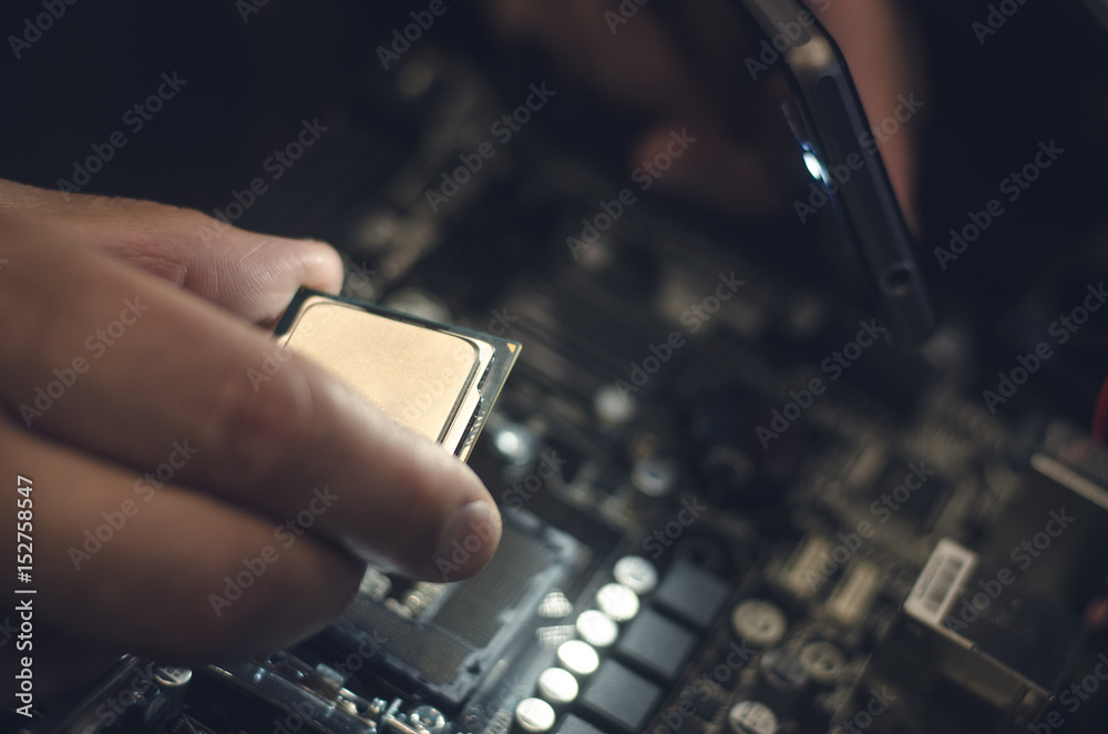 Computer processor. Technician installs CPU on motherboard. Computer processor. Technician installs CPU on motherboard.