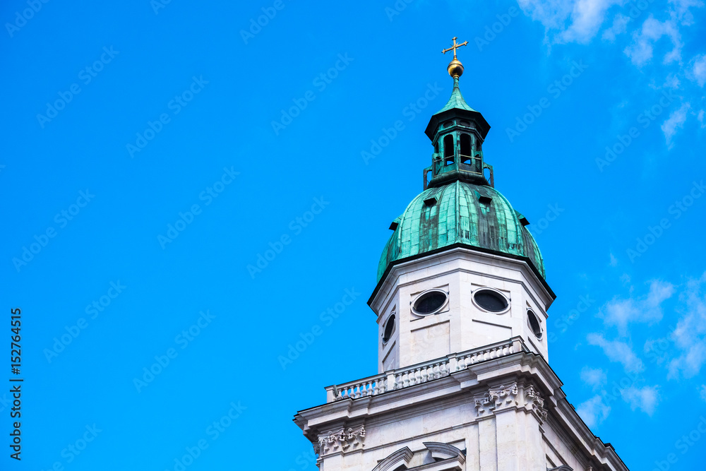 white tower,green roof,gold cross on top white tower,green roof,gold cross on top