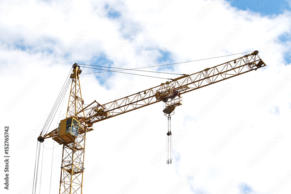Construction crane tower against a blue sky