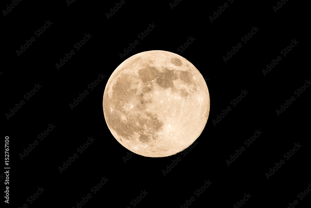 Nice full moon with soft yellow color an visible craters Nice full moon with soft yellow color an visible craters