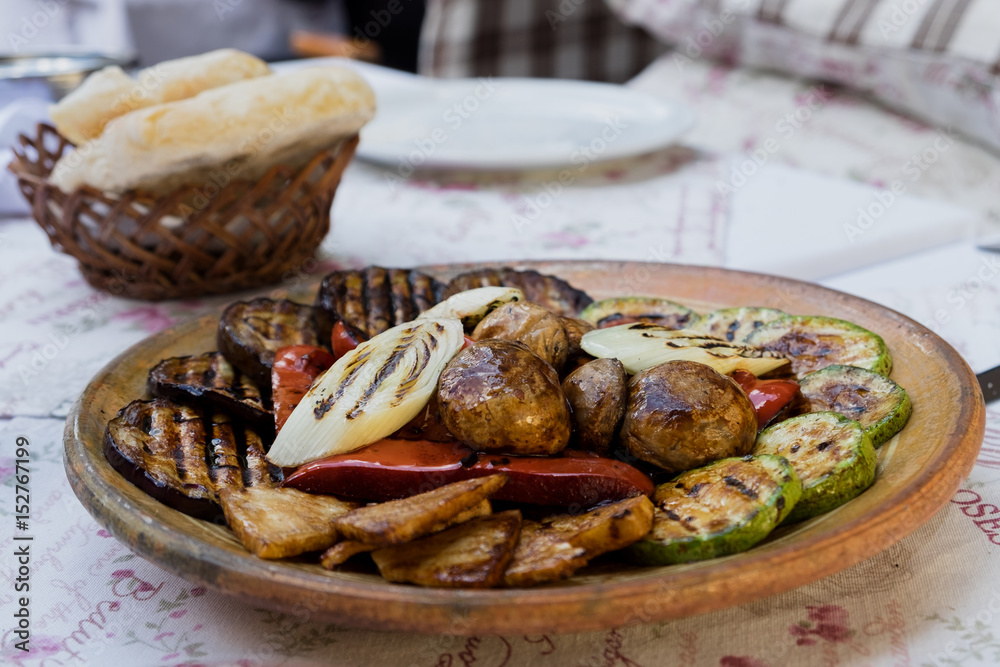 Grilled vegetables - onions, zucchini, peppers, eggplants and tomatoes served at the restaurant in Novi Sad, Serbia Grilled vegetables - onions, zucchini, peppers, eggplants and tomatoes served at the restaurant in Novi Sad, Serbia
