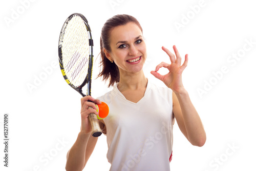 Woman with tennis racquet and ball