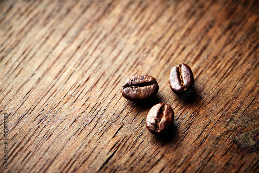 Fototapeta premium Dark Coffee Beans on Wooden Surface