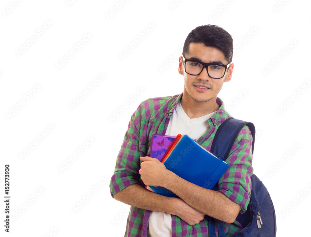 Young man with backpack and books Young man with backpack and books