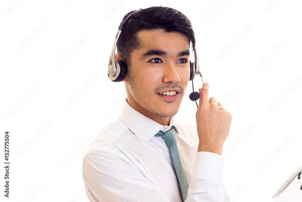 Young man in headphones holding a folder Young man in headphones holding a folder