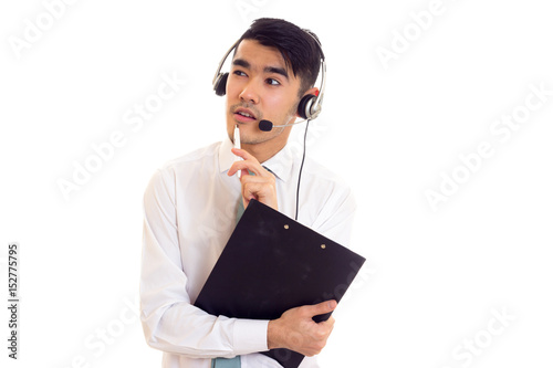 Young man in headphones holding a folder  photo