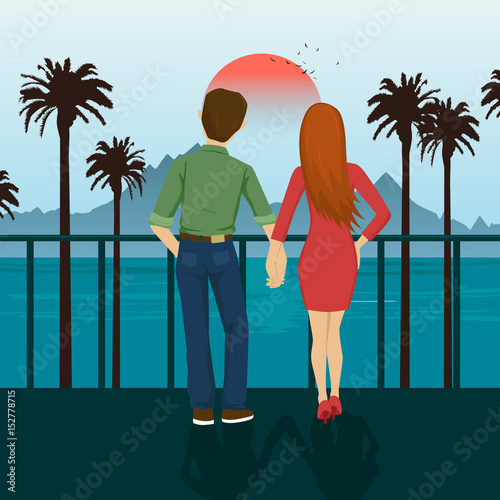 Young couple holding hands standing on seafront, looking at sunset. Mountains, sea, ocean, palm trees, seacoast