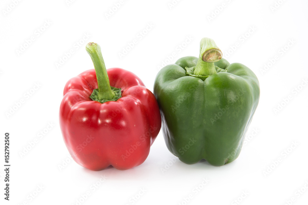 Red and green capsicum or sweet pepper isolated on white background Red and green capsicum or sweet pepper isolated on white background