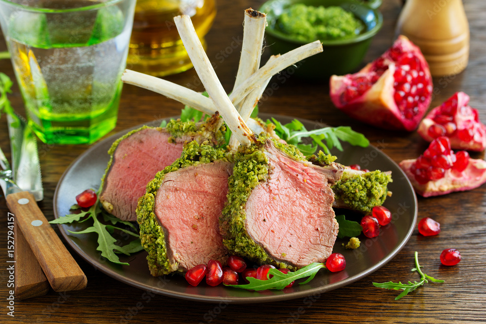 Rack of lamb in herb cheese and breadcrumbs. A festive meal. Selective focus. Rack of lamb in herb cheese and breadcrumbs. A festive meal. Selective focus.