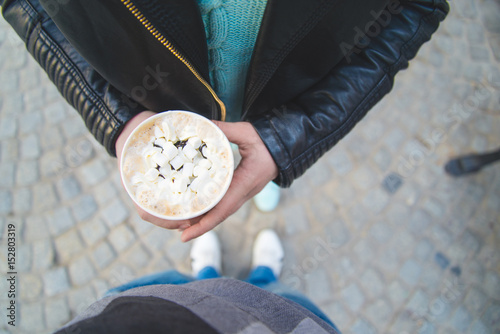 cup with coffeein hands photo