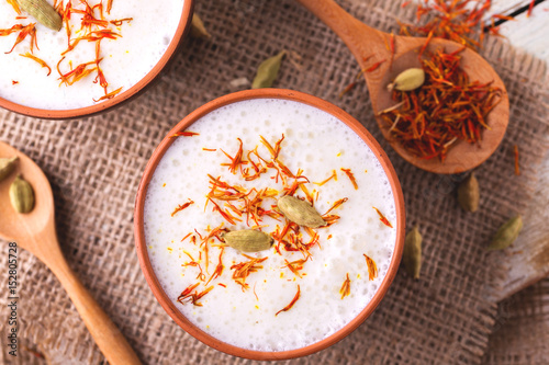 Traditional Indian lassi curd with cardamon and saffron. photo