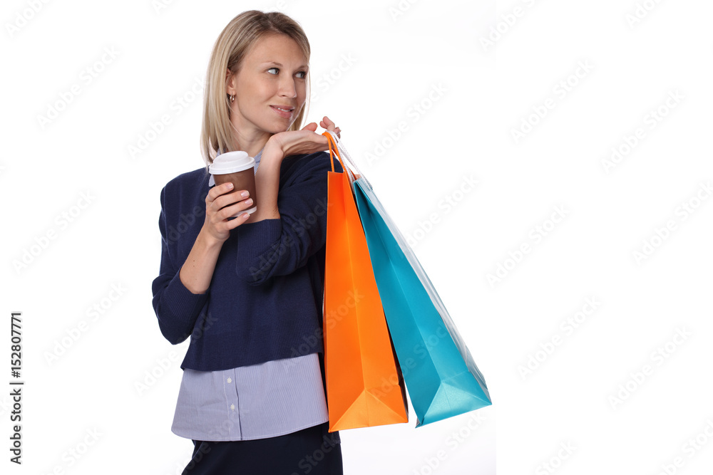 Happy young woman holding shopping bags isolated on white background Happy young woman holding shopping bags isolated on white background