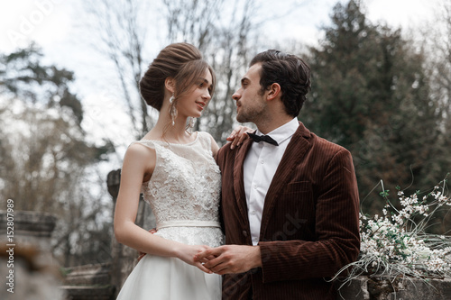 Bride and groom near ancient building