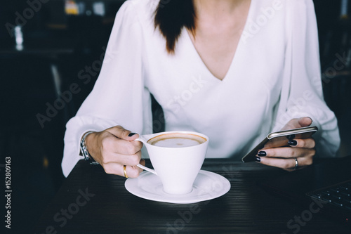 working woman using smart phone in cafe , business digital concept 