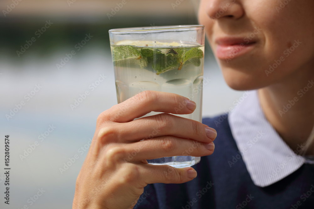 Happy Woman Drinking Summer Refreshing detox Water or Lemonade. Healthy Lifestyle Happy Woman Drinking Summer Refreshing detox Water or Lemonade. Healthy Lifestyle