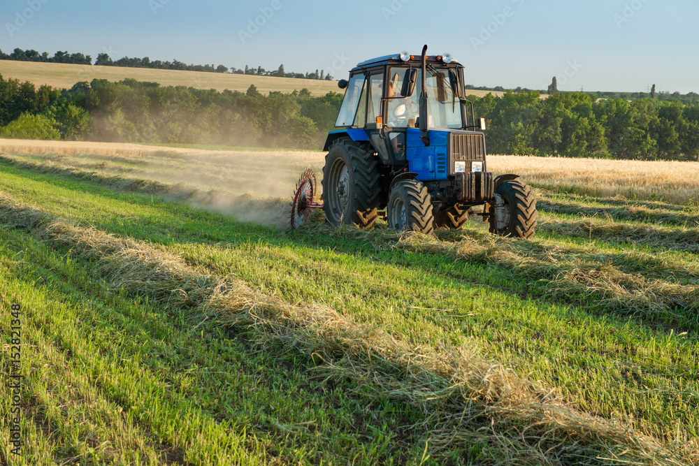 Tractor working on the farm field Tractor working on the farm field