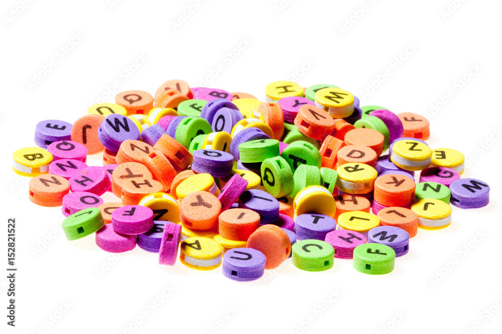 Fototapeta premium Chaotically folded multicolor circles with letters written on them on a white background