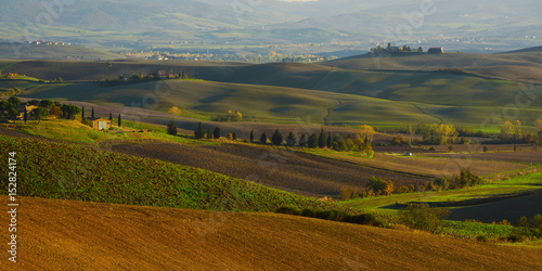 Wavy fields in Tuscany at sunset, Italy. Natural outdoor seasonal autumn background.