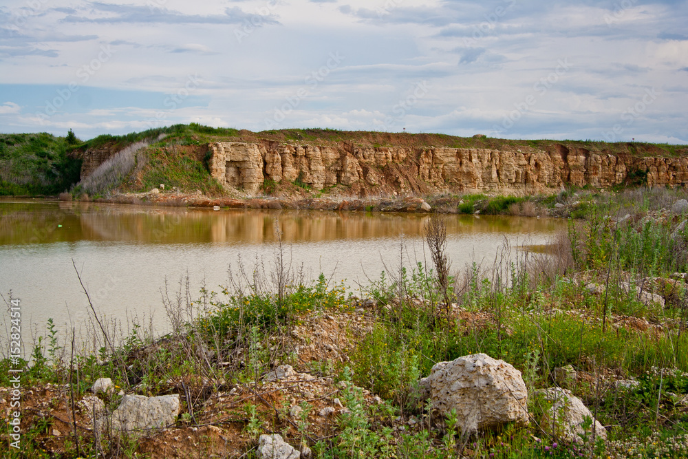 Limestone quarry with a pond
