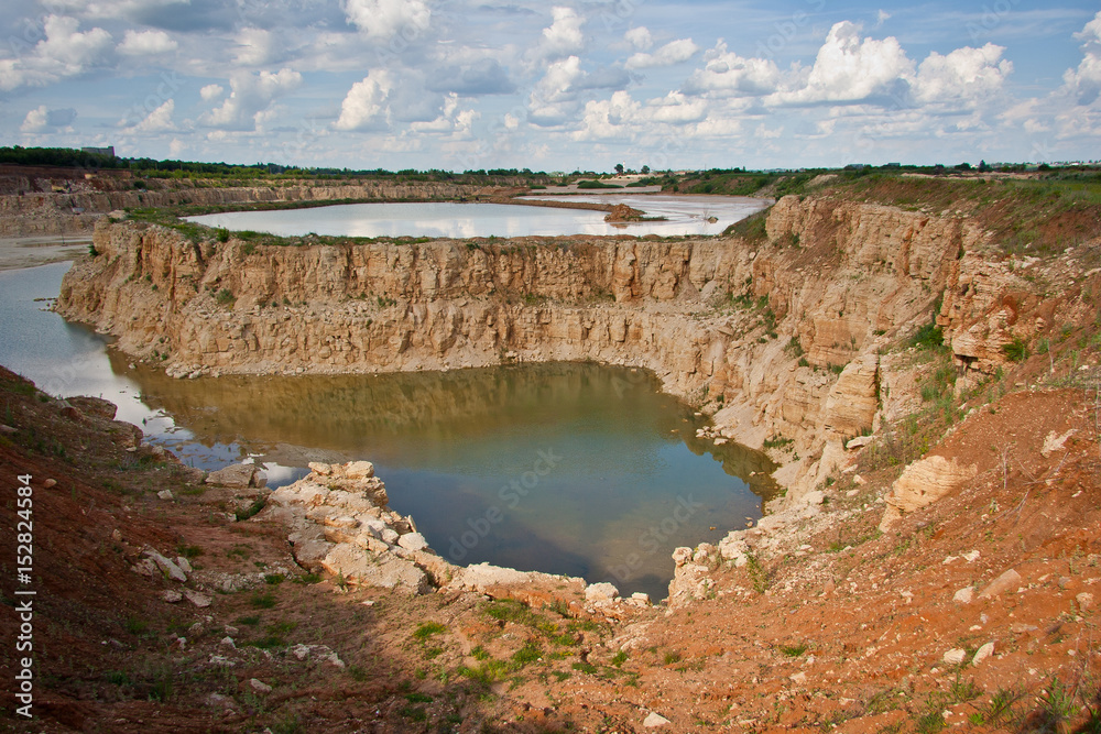 Limestone quarry with a pond