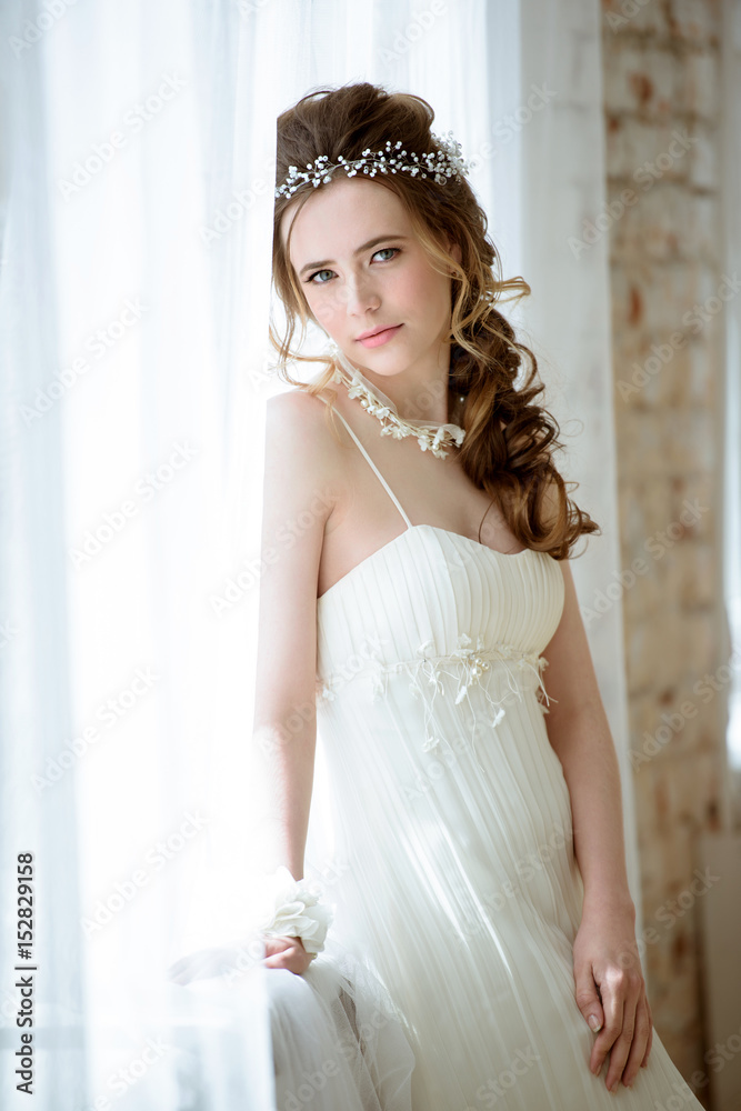 Brunette bride in fashion white wedding dress with makeup Brunette bride in fashion white wedding dress with makeup