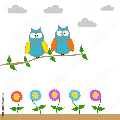 Owls on a branch of a tree