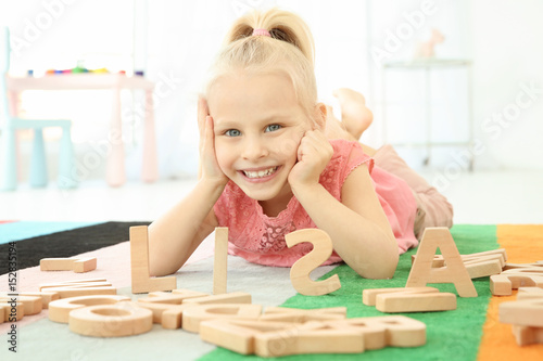 Cute little girl and word L...