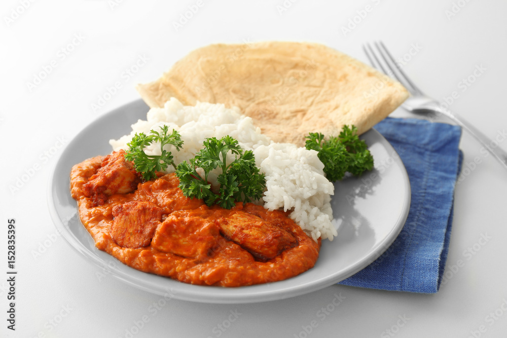 Plate with delicious Murgh Makhani on white background