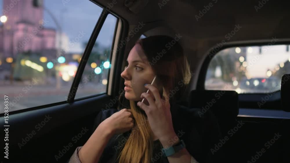 Businesswoman Having an Important Phone Call in the Car Businesswoman Having an Important Phone Call in the Car