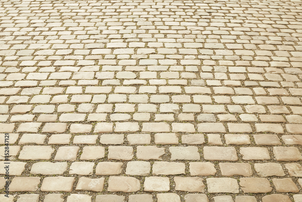 Beige granite mosaic pavement background