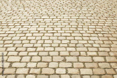 Beige granite mosaic pavement background
